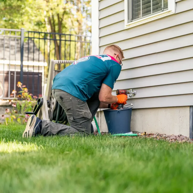 A picture of Clake working on home plumbing in NH